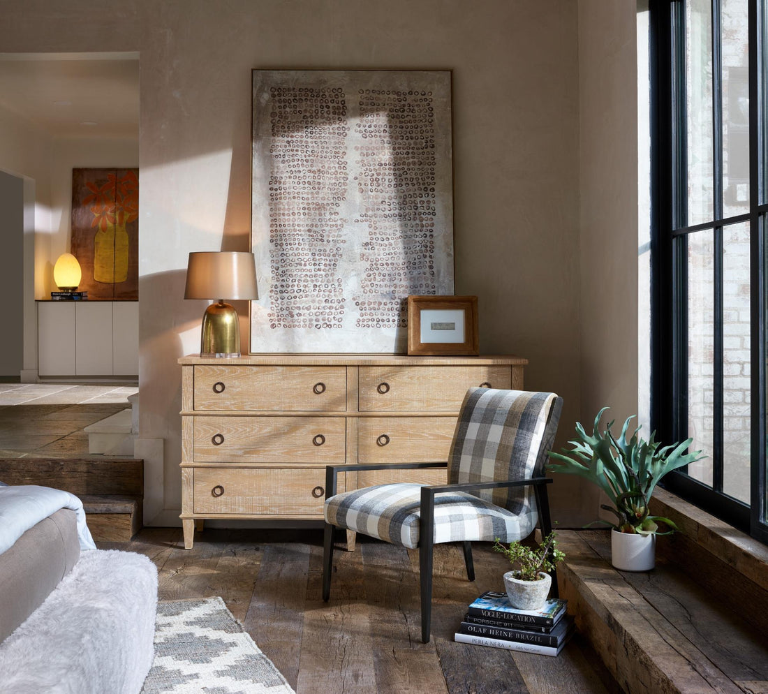 A six-drawer dresser beside a chair