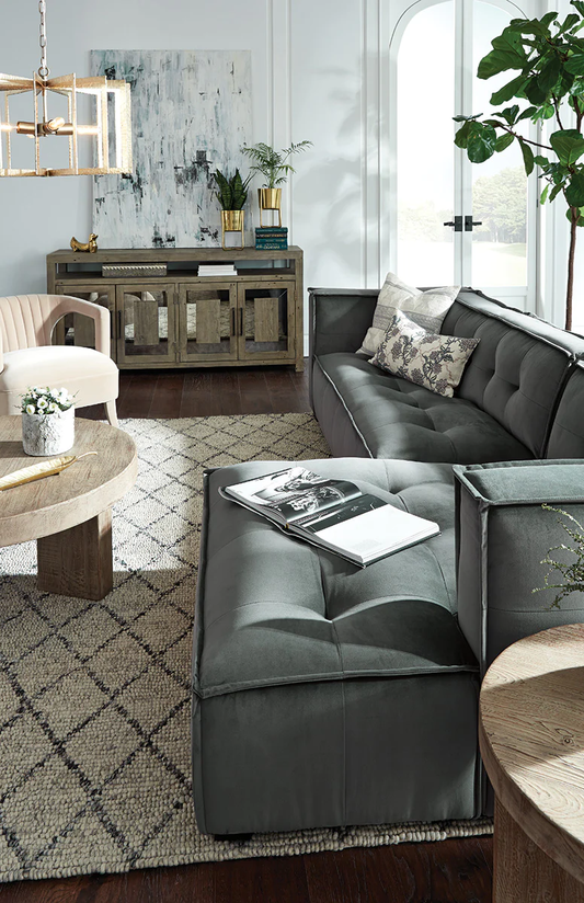 A smoke-colored modular sofa with a chaise lounge 