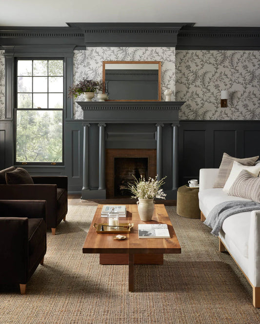 A beautifully decorated living room with an ideal rug placement