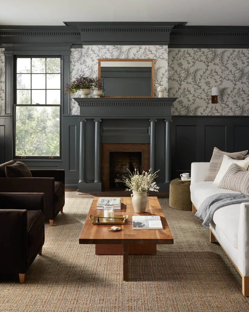 A beautifully decorated living room with an ideal rug placement
