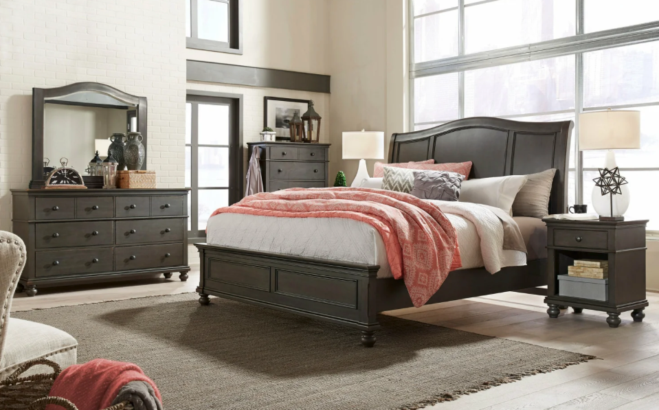 A stylish black sleigh-style bedroom set