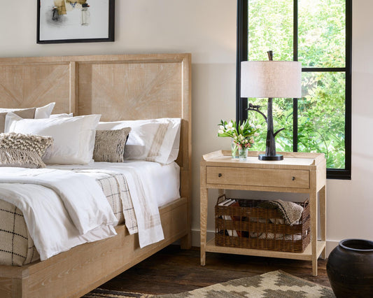 A light wooden colored French Country bedroom set