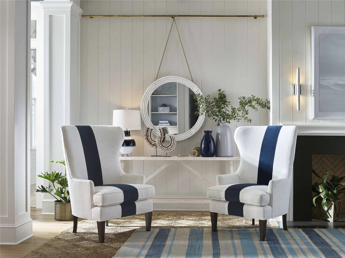 Two blue and white chairs and a blue and light-colored rug 