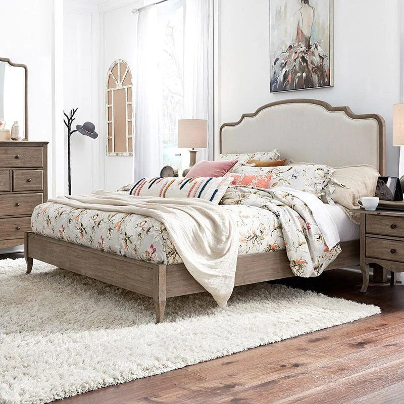 A beautiful white and wood upholstered bed frame