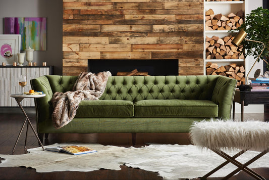 A beautiful velvet loveseat in a stylish living room