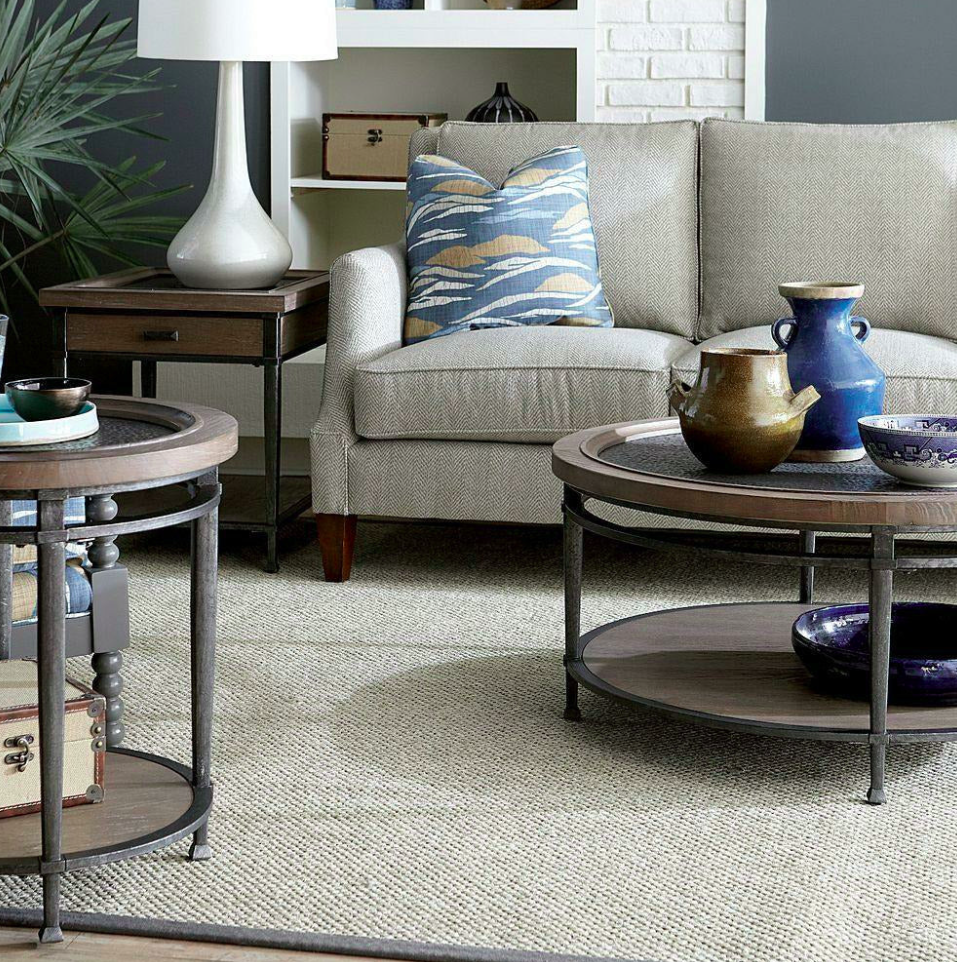  A gray couch, brown side table, and brown coffee table 