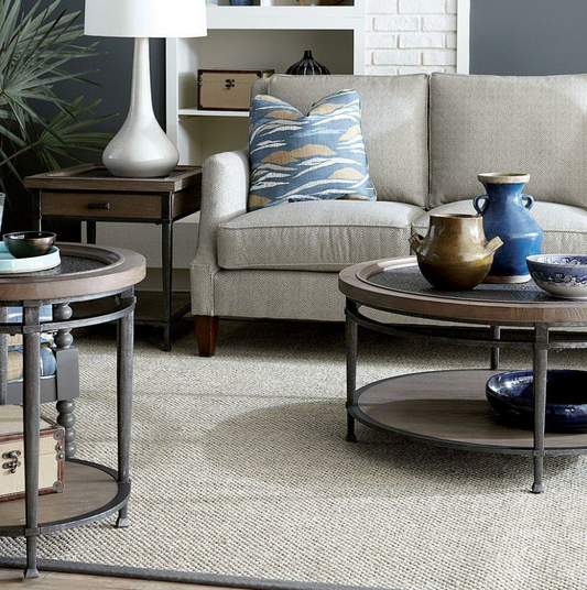  A gray couch, brown side table, and brown coffee table 