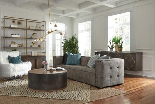 A stylish living room with a grey couch