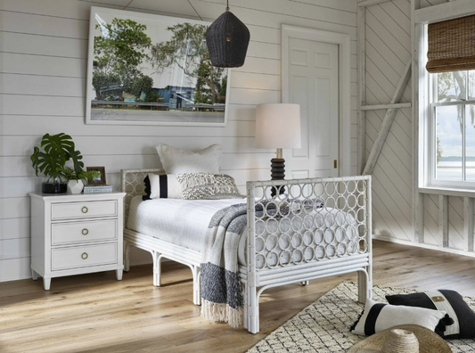 A coastal-style white daybed with circular accents